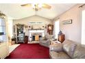 Cozy living room with stone fireplace, vaulted ceilings, and farmhouse-style decor at 24 Lady Savannah Dr, Dallas, GA 30157