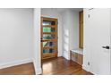 Bright foyer showcases a modern door, coat nook, and hardwood flooring at 800 Kiowa Ne Dr, Marietta, GA 30060