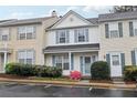 Attractive townhouse with blue shutters and a well-manicured front yard with flowering bushes at 10900 Wittenridge Dr # I4, Alpharetta, GA 30022