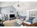 Comfortable living room with vaulted ceiling, ceiling fan, and neutral color palette at 33 Blue Springs Way, Dallas, GA 30157