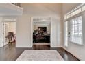 Open foyer with hardwood floors, high ceilings, and lots of natural light at 5525 Nesmith Ct, Cumming, GA 30040