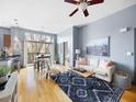 Bright living room with hardwood floors, comfortable seating, and access to a balcony at 2630 Talley St # 319, Decatur, GA 30030
