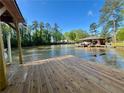 Waterfront home featuring a private boat dock with space for multiple boats and stunning views of the lake at 125 Mayo Rd, Covington, GA 30014