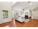 Spacious living room with fireplace, built-ins, and hardwood floors for seamless entertaining at 1605 Gilstrap Nw Ln, Atlanta, GA 30318