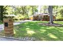 Brick home with a well-manicured lawn and a unique mailbox design at 4257 Webb Rd, Tucker, GA 30084
