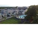 Aerial view of the resort-style pool with lounging areas and well-maintained landscaping at 100 Carlyle Ln, Fayetteville, GA 30214