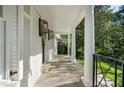 Stunning front porch with stone floor and black railings at 1305 Old Woodbine Rd, Atlanta, GA 30319