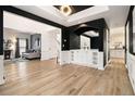 Bright living area with hardwood floors, open archway, and view into adjacent rooms at 4435 Bellwood Cir, Atlanta, GA 30349