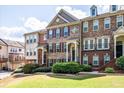 Charming brick townhome with manicured landscaping, a welcoming entrance, and classic architectural details at 2145 Shoop Se Ct # 3, Smyrna, GA 30080