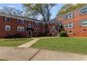 Quaint red brick building with a well-maintained lawn and lovely landscaping at 542 Goldsboro Ne Rd # C, Atlanta, GA 30307