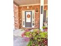 Inviting front entrance with brick facade and decorative fall wreath hanging on the door at 2269 Reddy Farm Ln, Grayson, GA 30017