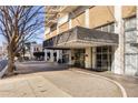 A clear entrance view of the building with a modern covered awning, the front area and sidewalks at 620 Peachtree Ne St # 1412, Atlanta, GA 30308