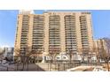 View of the high rise apartment building with multiple balconies and many windows, showcasing city living at 620 Peachtree Ne St # 1412, Atlanta, GA 30308