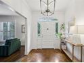 Bright foyer featuring a white door with sidelights and a decorative transom window at 8925 Huntcliff Lake Ct, Atlanta, GA 30350