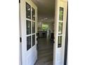 Inviting entryway with white paneled front door and view of open-concept kitchen and dining area at 3457 Skyview Dr, Lithia Springs, GA 30122