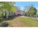 Well-maintained home with a beautifully landscaped front yard and an attached two-car garage at 4965 Skyland Pkwy, Cumming, GA 30028