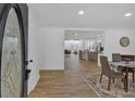 Inviting entryway opens to a combined living and dining area with stylish modern finishes at 144 Cathy Ln, Hiram, GA 30141
