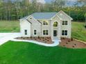 Newly built home with a lush green lawn and an inviting exterior at 247 Lotus Ln, Covington, GA 30016