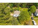 Aerial view of a home showcasing lush landscaping and a multi-car driveway at 6500 Chickasaw Dr, Douglasville, GA 30135