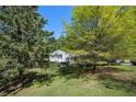 View of home through a variety of different trees creating a tranquil and private setting at 6500 Chickasaw Dr, Douglasville, GA 30135