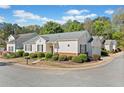 A charming single-story home with manicured landscaping, set in a peaceful neighborhood at 1228 W Oaks Way, Woodstock, GA 30188