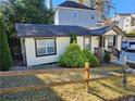 A view of the side of this charming bungalow with a fenced yard and greenery at 3268 Mae Ave, Brookhaven, GA 30319
