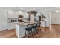 Bright kitchen with granite countertops, a center island with seating, and stainless steel appliances at 6102 Marigold Way, Atlanta, GA 30349