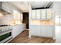 Bright kitchen featuring white cabinetry, modern appliances, and a stylish backsplash at 1501 Clairmont Rd # 1818, Decatur, GA 30033