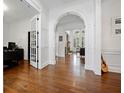 Open entryway with hardwood floors leading to a cozy living space at 1045 Westcroft Ln, Roswell, GA 30075