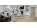 Sun-filled living area with fireplace, neutral color palette, and an open layout to adjacent spaces at 2840 Alpine Rd, Atlanta, GA 30305