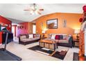 Inviting living room with comfortable seating, rich paint colors, and a decorative fireplace at 4924 Antelope Cv, Atlanta, GA 30349