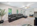 Cozy living room featuring plush carpeting, neutral tones, and abundant natural light at 7060 Steel Wood Nw Dr, Kennesaw, GA 30152