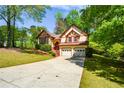Charming two-story Tudor-style home with a two-car garage, set in a lush, green environment at 2261 Byron Sw Ct, Marietta, GA 30064