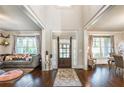 Bright and airy entryway with hardwood floors, a stylish rug, and views to adjacent living spaces at 2270 Abbey Cove Ct, Marietta, GA 30062