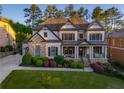 Attractive two-story home with well-maintained lawn, shrubbery, and inviting front porch at 2270 Abbey Cove Ct, Marietta, GA 30062