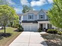 Charming two-story home featuring a well-manicured front yard and attached two-car garage at 2641 Se Parks Edge Se Dr, Smyrna, GA 30080