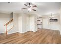 An open-concept living room features wood floors, neutral walls, and crown molding at 527 Pringle Dr, Suwanee, GA 30024
