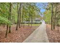 View of a charming house with mature trees surrounding the property at 469 Kimberly Ct, Mcdonough, GA 30252