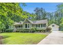 Beautiful exterior view of this home with an attached garage and manicured lawn at 469 Kimberly Ct, Mcdonough, GA 30252