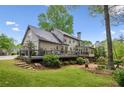 Expansive back exterior with a large deck perfect for entertaining and enjoying the outdoors at 640 Sibley Se Frst, Marietta, GA 30067