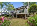 Beautiful backyard featuring a screened porch and a walkout basement with covered patio at 640 Sibley Se Frst, Marietta, GA 30067