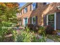 Lovely brick home featuring a bright blue door and landscaped front garden at 3051 Deanna Way, Lawrenceville, GA 30044
