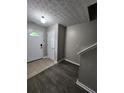 Inviting foyer featuring modern flooring, neutral walls, and a bright front door at 3336 Waldrop Trl, Decatur, GA 30034