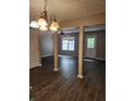 Spacious living room with hardwood floors, a ceiling fan, and plenty of natural light at 3336 Waldrop Trl, Decatur, GA 30034