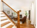 Elegant staircase with wooden treads and black iron railings, leading to the upper level of the house at 4175 Valley Trail Se Dr, Atlanta, GA 30339