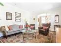 Bright living room with neutral walls, vintage rug, and comfortable seating arrangement at 2029 Tuxedo Ne Ave, Atlanta, GA 30307