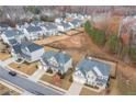 Aerial view of a residential neighborhood showcasing well-maintained homes and expansive yards at 3945 Starwood Dr, Cumming, GA 30028