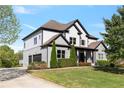 Well maintained home with attached garage, manicured landscaping, and a spacious front yard at 1186 Lincoln Dr, Marietta, GA 30066
