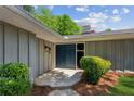 Stylish front entrance with a double door and a neatly landscaped yard with green bushes at 553 Candlewood Dr, Stone Mountain, GA 30088