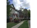 Row of townhomes showcasing landscaping, sidewalks, and inviting exterior stairways at 1186 Ridenour Blvd # 5, Kennesaw, GA 30152